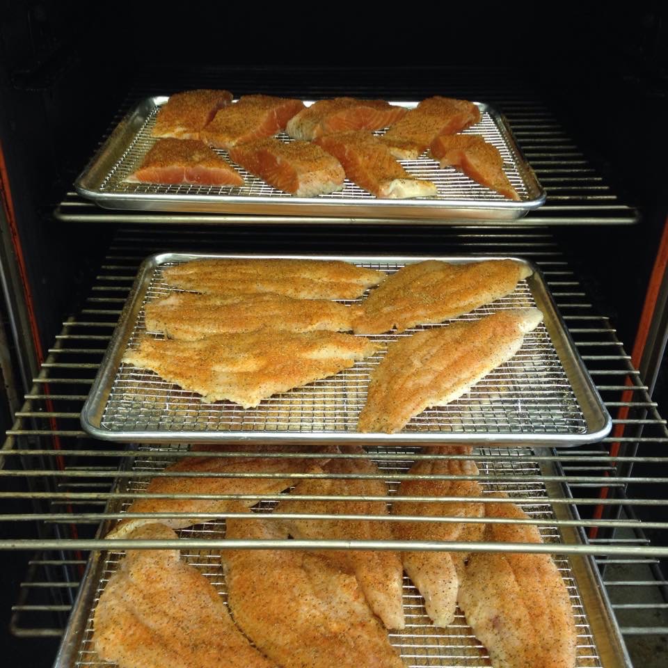 Trays of Fried Fish on Metallic Grill Racks