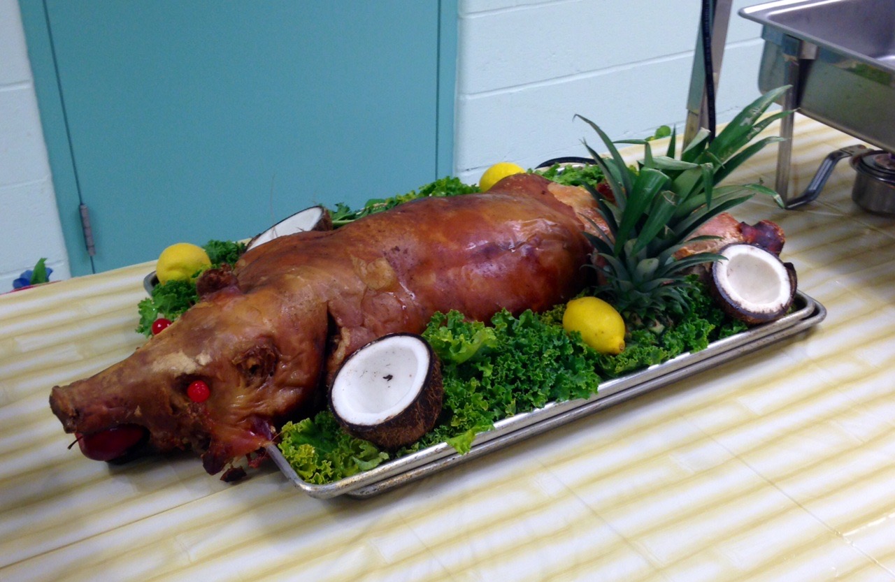 A Roasted Hog on a Platter of Celery