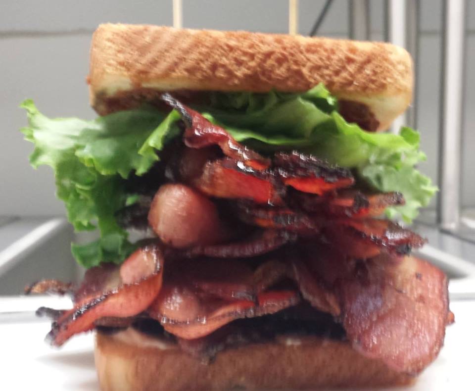 A Bacon Loaded Sandwich With Lettuce