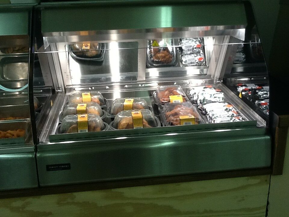 A Glass Case With Food Samples Placed on Trays